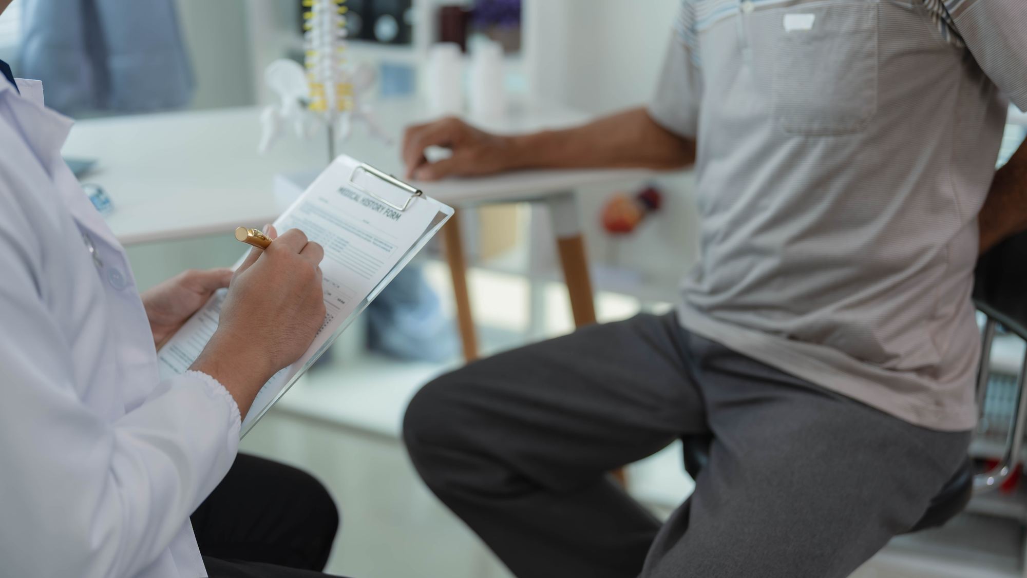 Clinician reviewing a form with a patient
